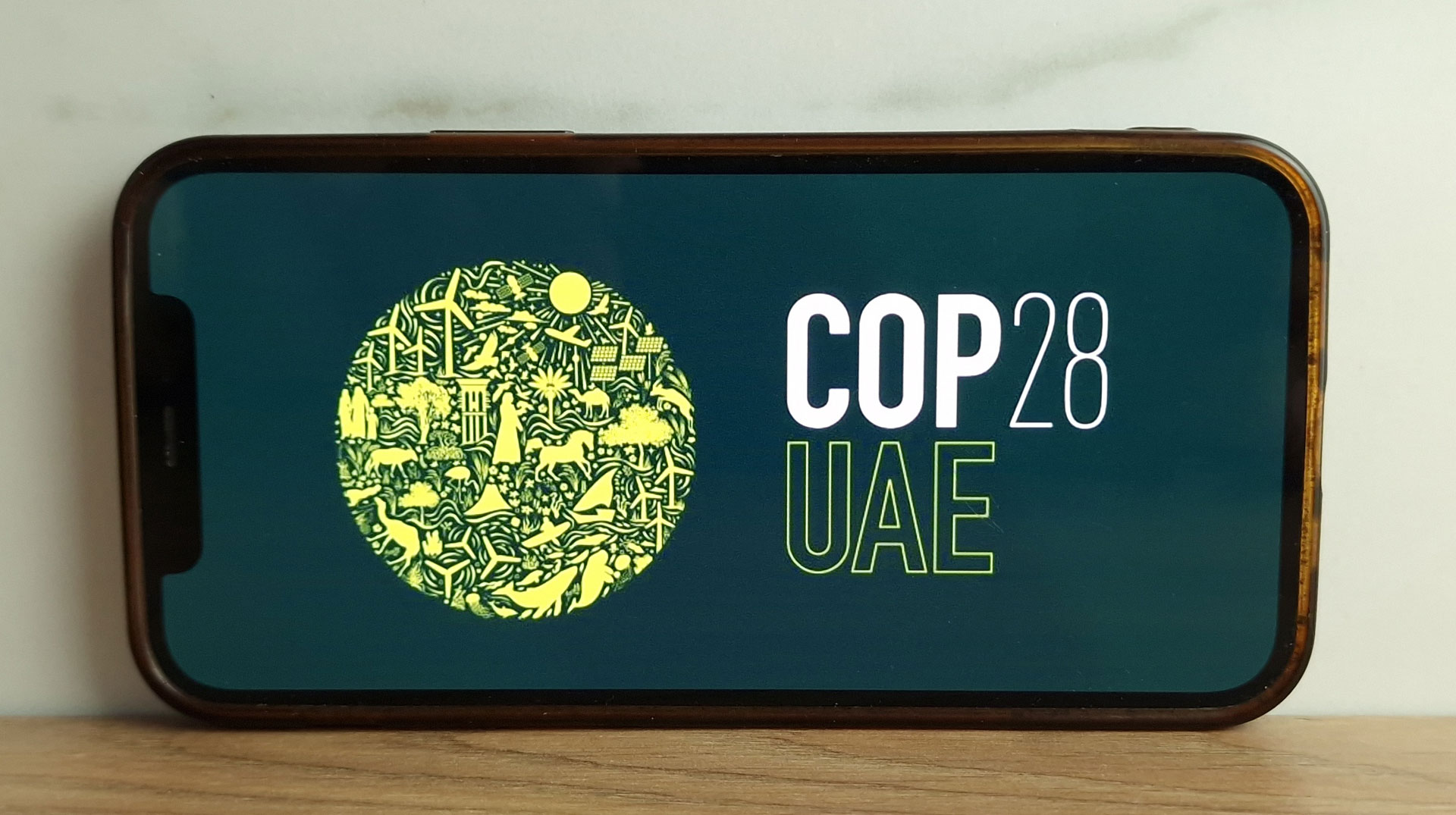 COP28 UAE United Nations Climate Change Conference logo displayed on mobile phone screen