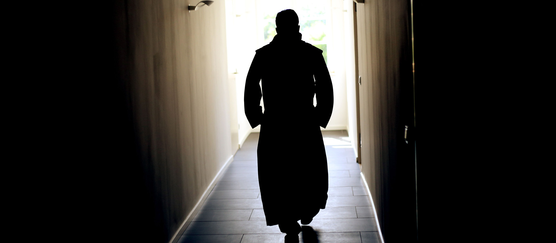 A monk walks through the monastery of Michaelsberg Abbey in Siegburg.