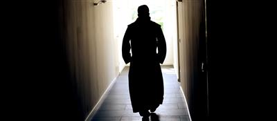 A monk walks through the monastery of Michaelsberg Abbey in Siegburg.