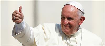 Pope Francis gives a thumbs-up.
