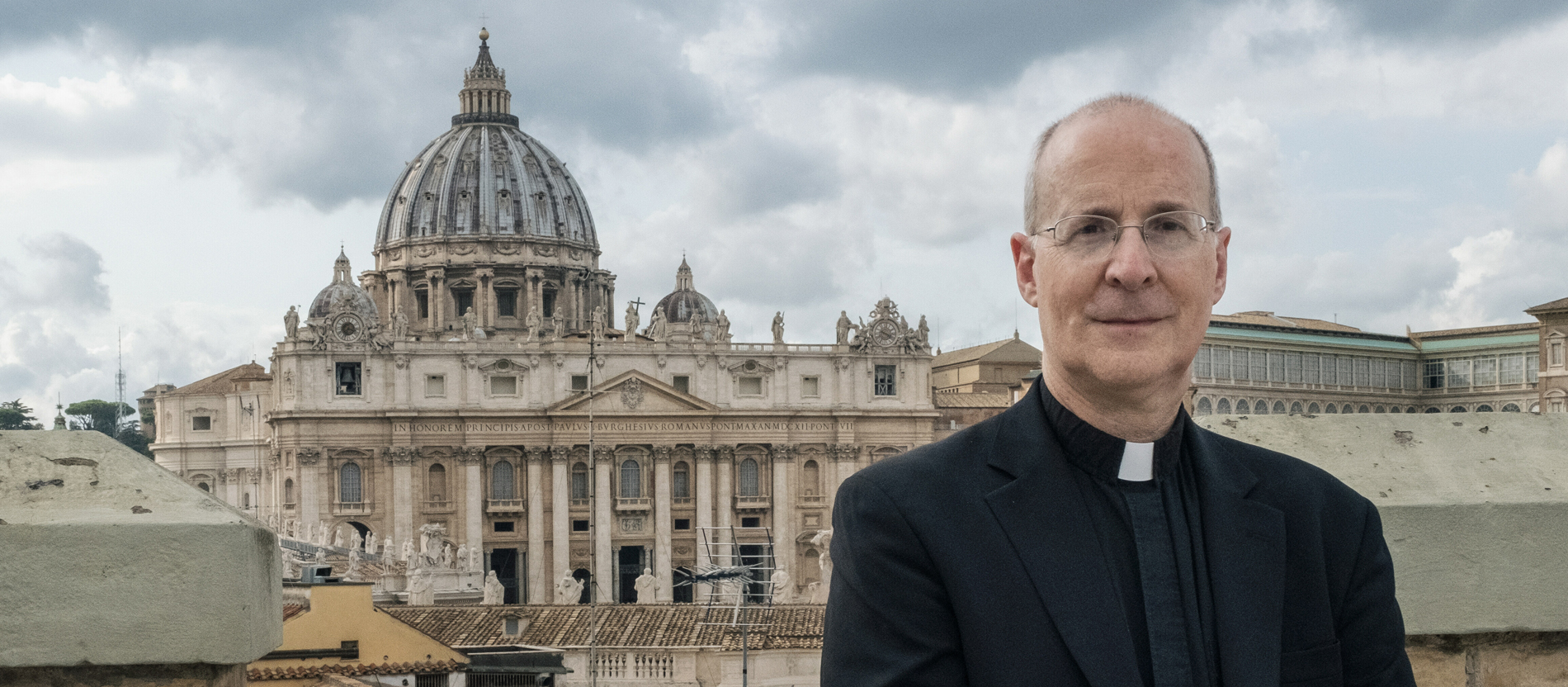 Jesuit James Martin in Rome. In the background: St Peter's Basilica.