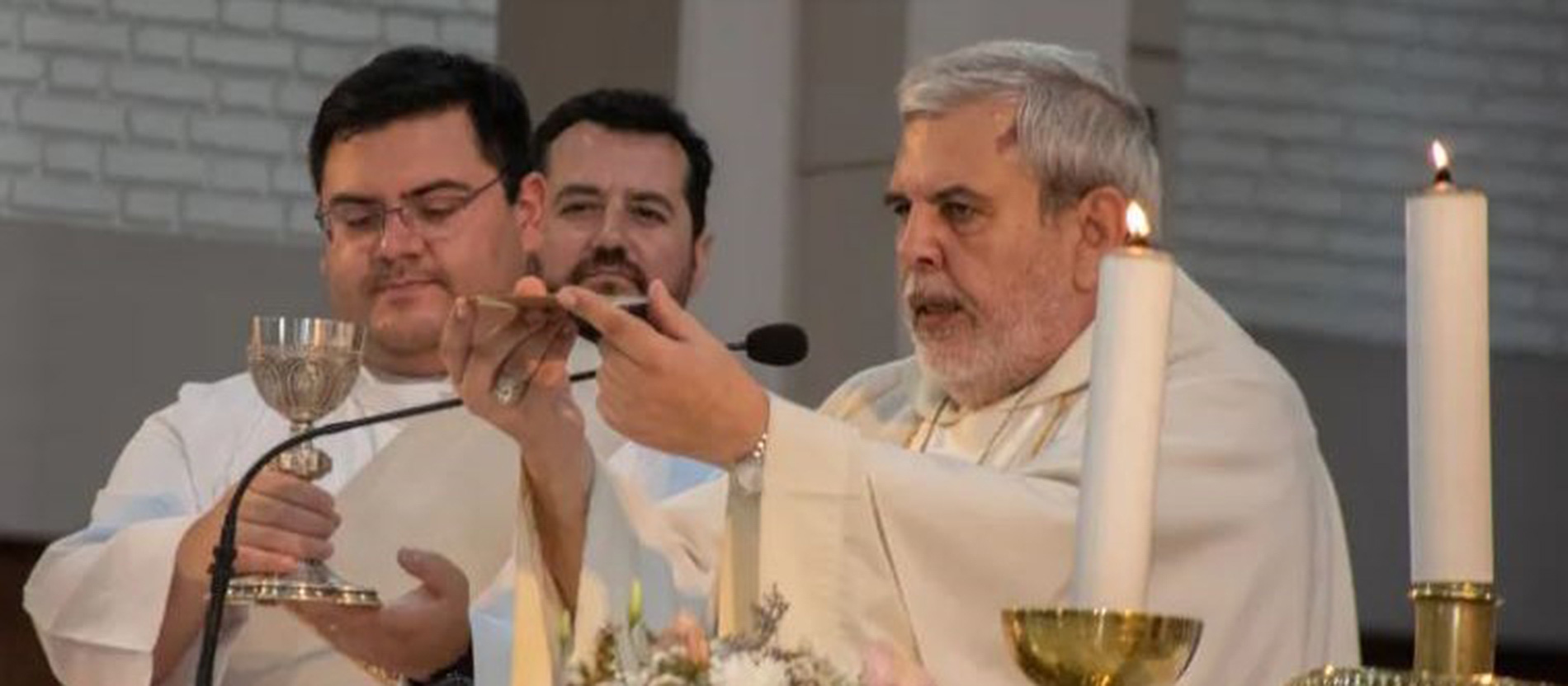 Bishop Gustavo Larrazábal (right) celebrates Mass